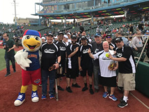 Group picture on baseball field with Mascot