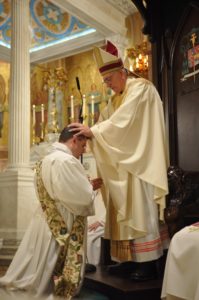Fr Michael Falce hands on