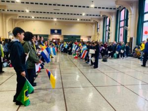 Kids holding flags in a row