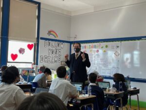 Dr. Miguel Martinez-Saenz, President of St. Francis College, visiting an eighth-grade class at Bay Ridge Catholic Academy.