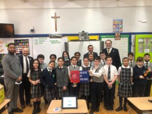 St. Francis College President Dr. Miguel Martinez-Saenz took a photo with the fourth-graders at Bay Ridge Catholic Academy after sharing some inspiring words.