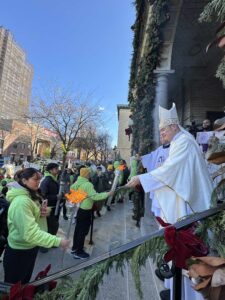 Bishop Brennan lights torches