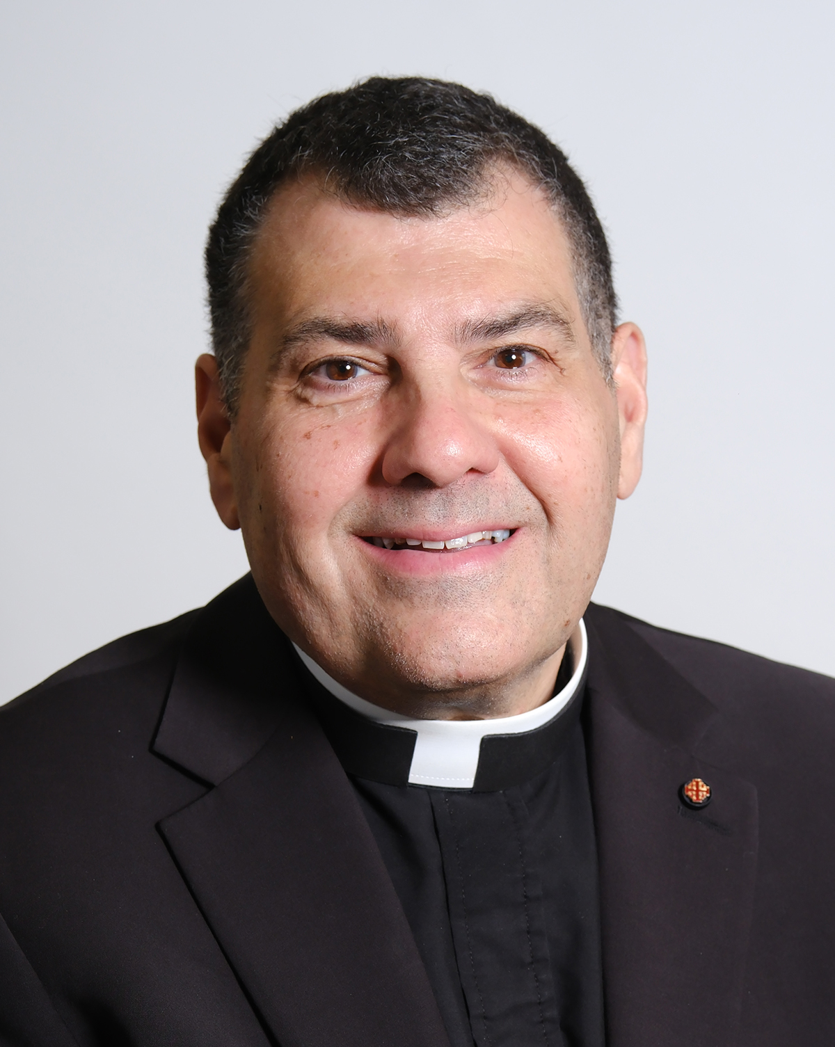 Adamo, Very Rev. Robert B