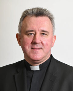 Dymek, Rev. Janusz